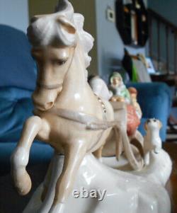 Hugh ceramic horse and sleigh, four people and dog (used to be music box)