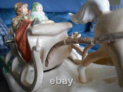 Hugh ceramic horse and sleigh, four people and dog (used to be music box)